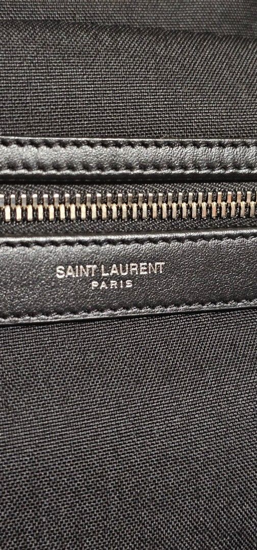 Saint Laurent City Backpack (Category: Luxury Bags & Wallets) located in Cebu City. Submitted by dg_enterprise (Listing ID 1433346514, Image 2). Description: - Authentic Saint Laurent City backpack - Color: Black Canvas - Features a front zip pocket with leather trim and silver-tone zipper - Includes dust bag and authenticity cards - Interior features a Saint Laurent leather patch - Adjustable straps and top handle - Saint Laurent logo visible on