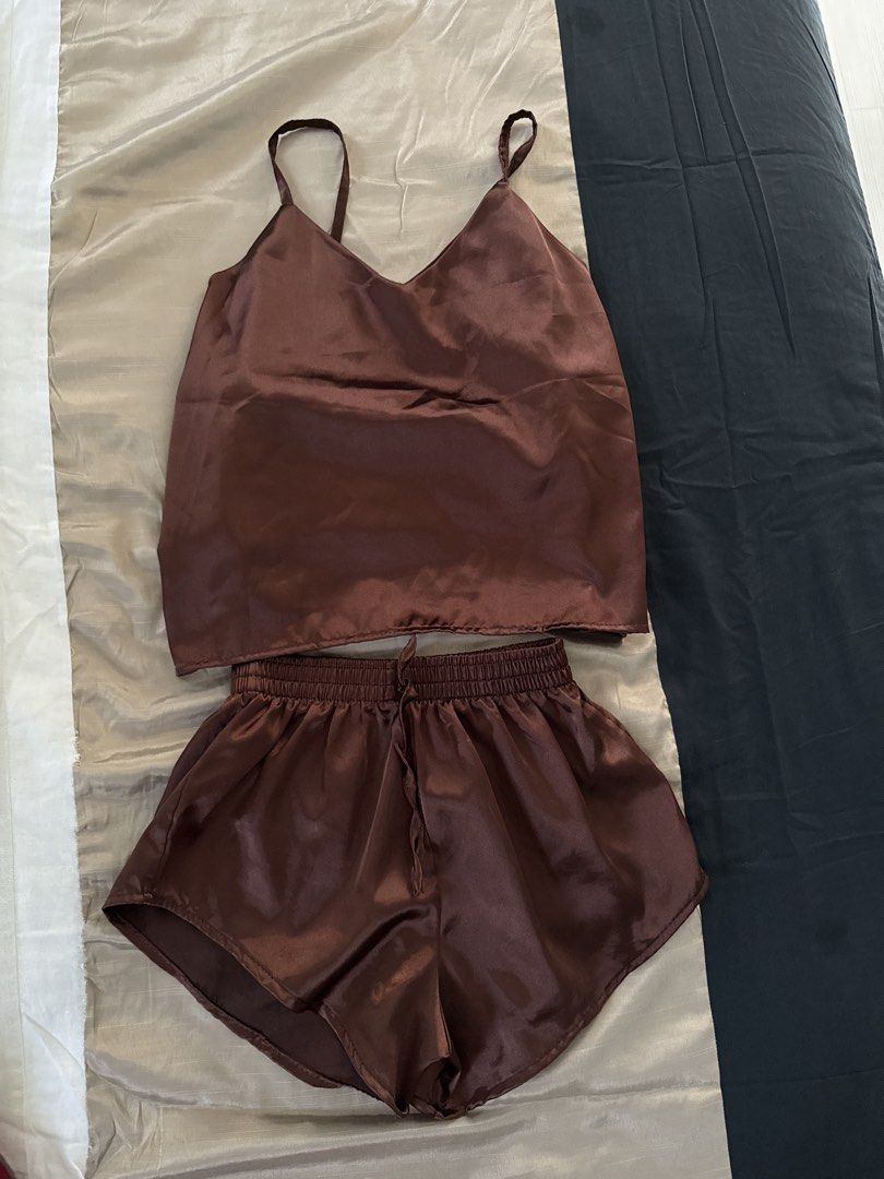 Satin Sleepwear Set (Category: Undergarments & Loungewear) located in Manila. Submitted by efgm123 (Listing ID 1433297815, Image 1). Description: - Brown satin sleepwear set - Includes camisole top with spaghetti straps - Shorts with elastic waistband and drawstring - Smooth, shiny fabric - Perfect for a comfortable night's sleep.