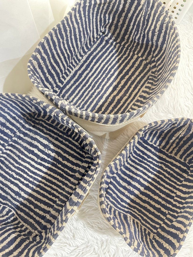 Set of 3 Fabric Storage Baskets (Category: Storage Boxes & Baskets) located in Bayambang. Submitted by foursiblings081228 (Listing ID 1433210615, Image 3). Description: - Set of 3 fabric storage baskets - Beige exterior - Navy blue and white striped interior - Features "My Things" label - Dimensions: Approximately 10 inches x 8 inches x 4 inches - Perfect for organizing small items.