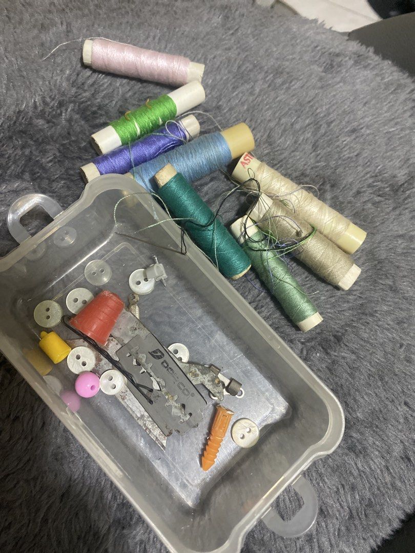 Sewing Kit with Threads and Accessories (Category: Craft Supplies & Tools) located in Marikina City. Submitted by myprelovedcollectibles (Listing ID 1433347713, Image 2). Description: - Complete sewing kit for all your basic needs. - Includes a variety of colored threads and sizes. - Comes with needles, buttons, and essential tools. - Features a clear plastic container with a yellow lid for easy storage. - Perfect for small sewing projects and em