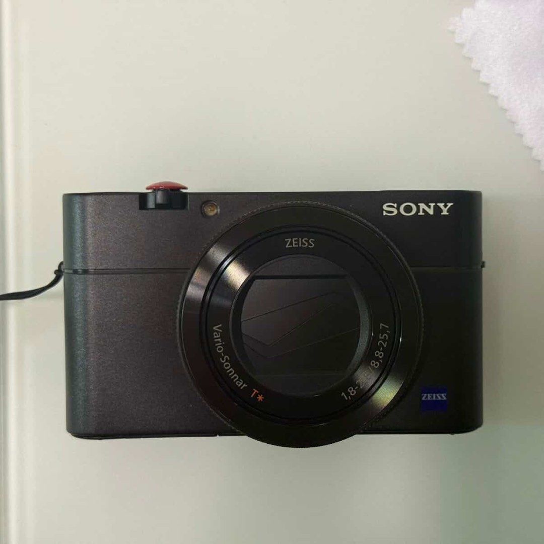 Sony RX100 M5 (Category: Cameras) located in Manila. Submitted by scorpiomoon00 (Listing ID 1433336431, Image 1). Description: -No damage - Sony digital camera with Zeiss lens - Built-in flash - Display screen - Wi-Fi enabled - Includes wrist strap - Comes with carrying pouch - Multiple control buttons and dials - Features finder and menu buttons.