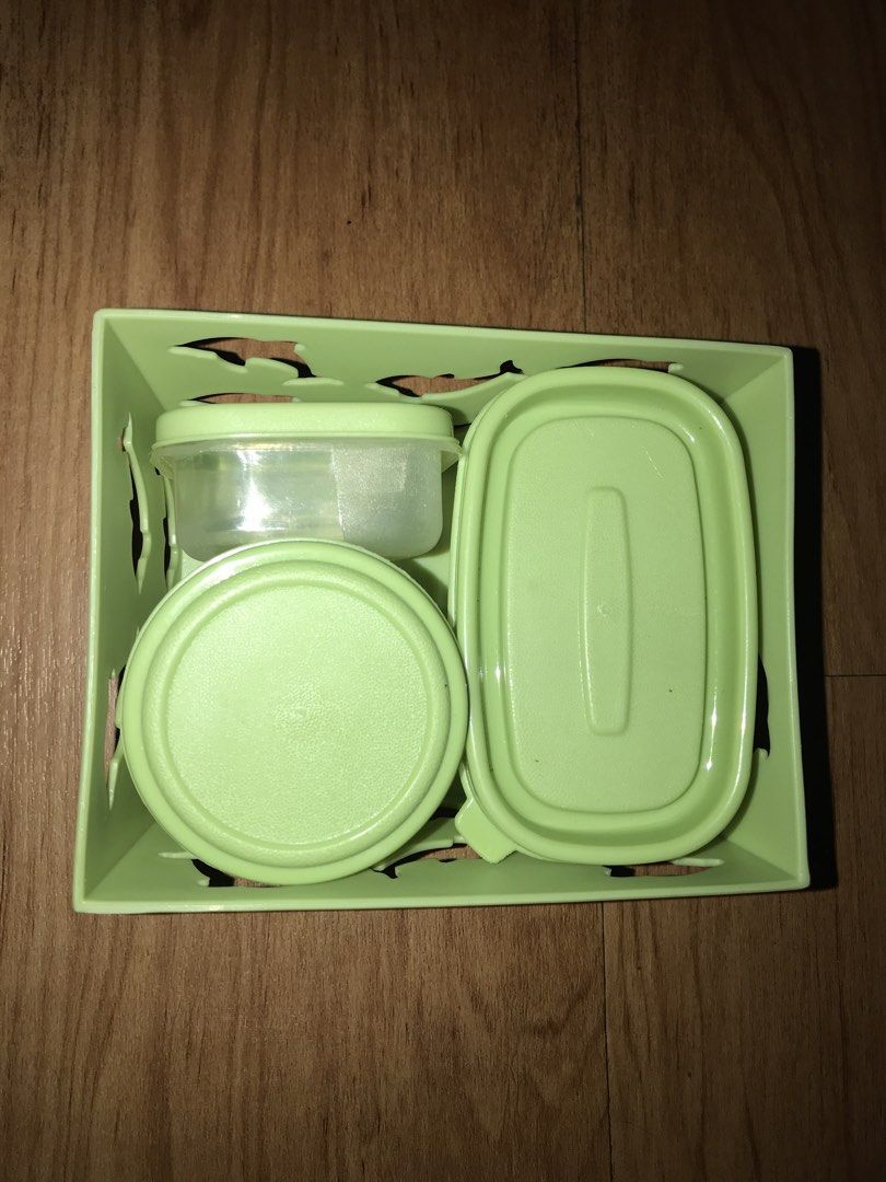 Storage Containers Set (Category: Storage Boxes & Baskets) located in Pasig City. Submitted by papotzy (Listing ID 1433264999, Image 1). Description: - Green storage container set - Includes one large container and three smaller containers with lids - Various shapes and sizes - Ideal for organizing small items - Made of plastic - Light green color.