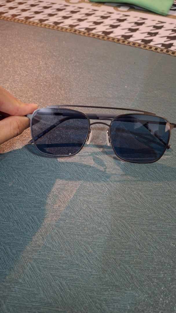 Sunglasses with Blue Tinted Lenses (Category: Sunglasses & Eyewear) located in Las Pinas. Submitted by mgr29 (Listing ID 1433336371, Image 1). Description: - Blue tinted lenses - Dark metal frame - Rectangular lens shape - Classic design - Suitable for everyday wear - Thin and sleek arms - White nose pads - Please see flaws.