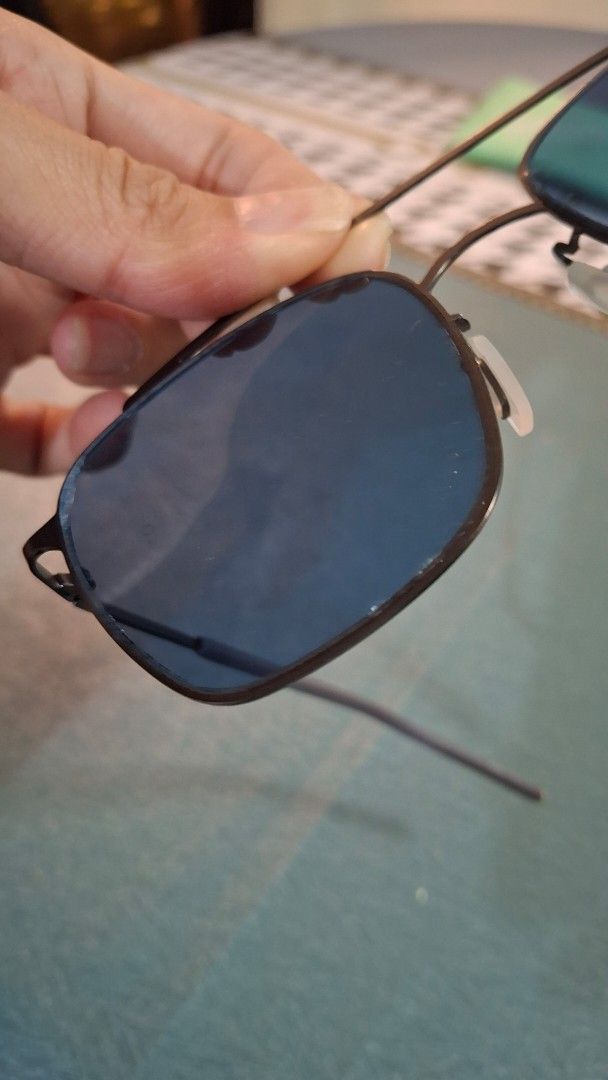 Sunglasses with Blue Tinted Lenses (Category: Sunglasses & Eyewear) located in Las Pinas. Submitted by mgr29 (Listing ID 1433336371, Image 3). Description: - Blue tinted lenses - Dark metal frame - Rectangular lens shape - Classic design - Suitable for everyday wear - Thin and sleek arms - White nose pads - Please see flaws.