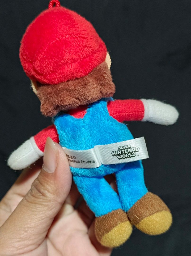 Super Nintendo World Super Mario Plush Keychain (Category: Character Goods) located in Compostela. Submitted by buenaflora04681 (Listing ID 1433211136, Image 3). Description: Keychain type.
