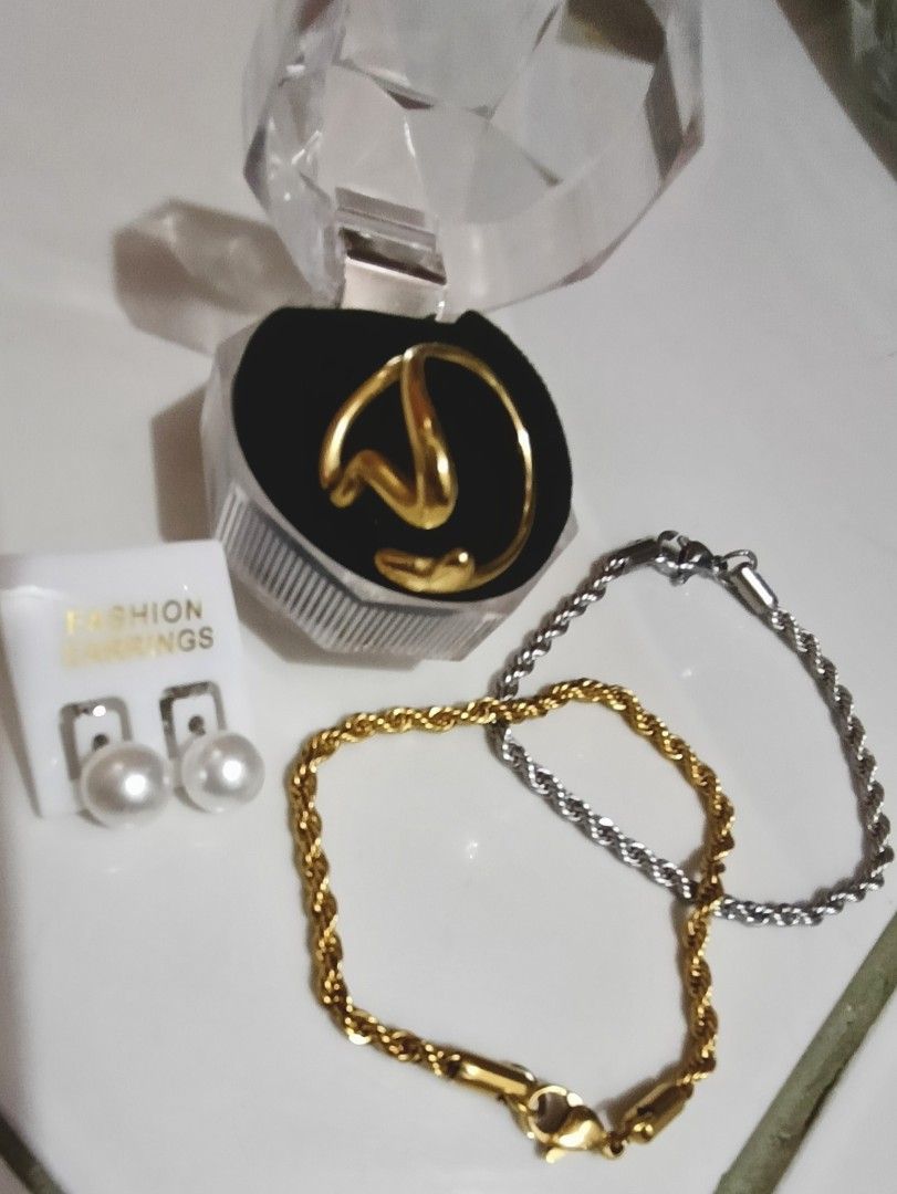 Take All Stainless Steel Ring & Bracelets (Category: Luxury Accessories) located in Manila. Submitted by trendyie100 (Listing ID 1432061167, Image 3). Description: Take all na po as is, 1pc Heart Gold Tone Stainless Steel Ring, fit to size 7 or 8 and 2pcs Rope Bracelet, fit up to 7.2inches wrist, hypoallergenic, solid pwede pang everyday use. Pretty in actual. Comes with FREE fashion earrings. •Payment st policy •No return, no exchange, no refund