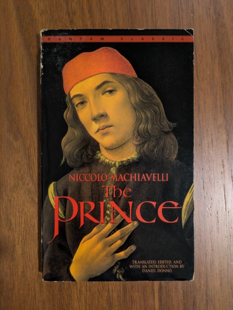The Prince by Niccolo Machiavelli Bantam Classics (Category: Storybooks) located in Manila. Submitted by toyroom (Listing ID 1433307453, Image 1). Description: - Bantam Classic edition of "The Prince" by Niccolo Machiavelli. - Includes selections from Machiavelli's "Discourses". - Features an introduction and notes by translator Daniel Donno. - Discusses themes of leadership and power politics. - Cover art: Portrait of a man wearing a red hat..