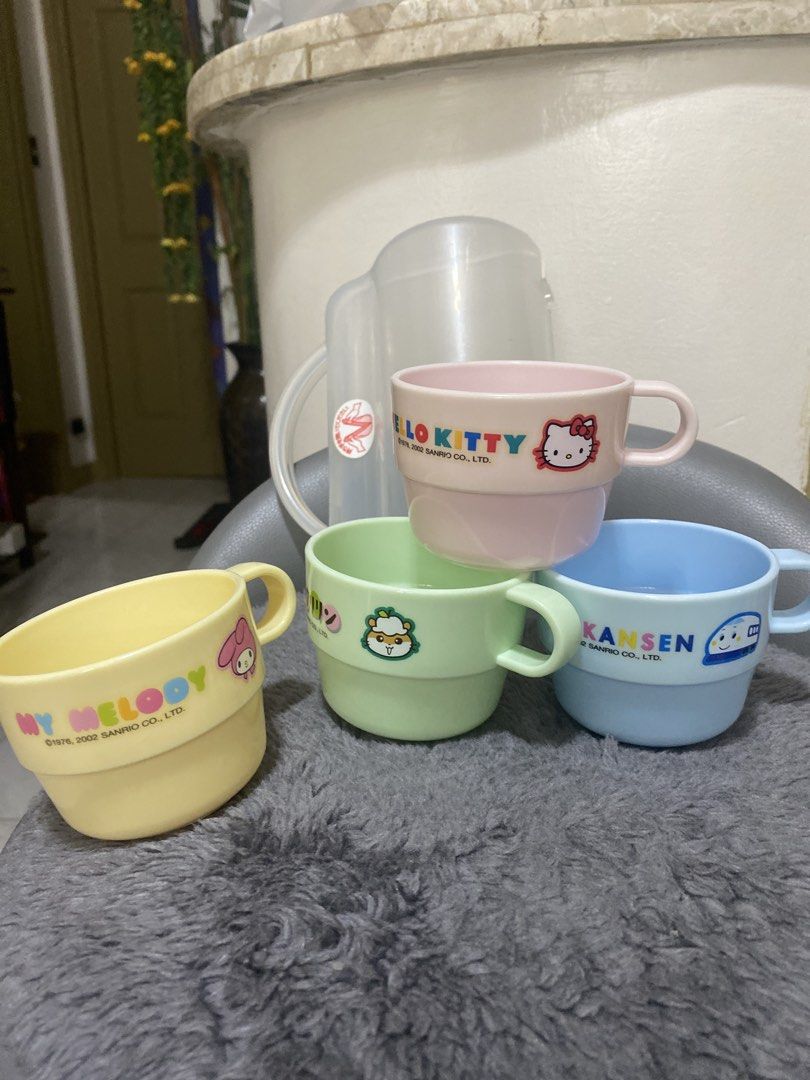 Vintage! Sanrio Stackable Cups Set (Category: Coffee & Tea Tableware) located in Marikina City. Submitted by myprelovedcollectibles (Listing ID 1433245800, Image 2). Description: - Sanrio character cup set - Includes four stackable cups - Features Kitty, My Melody, and two other characters - Comes with a clear plastic container - Pastel colors - Made of plastic - One cup marked "KS-G1" and "Made in Japan".