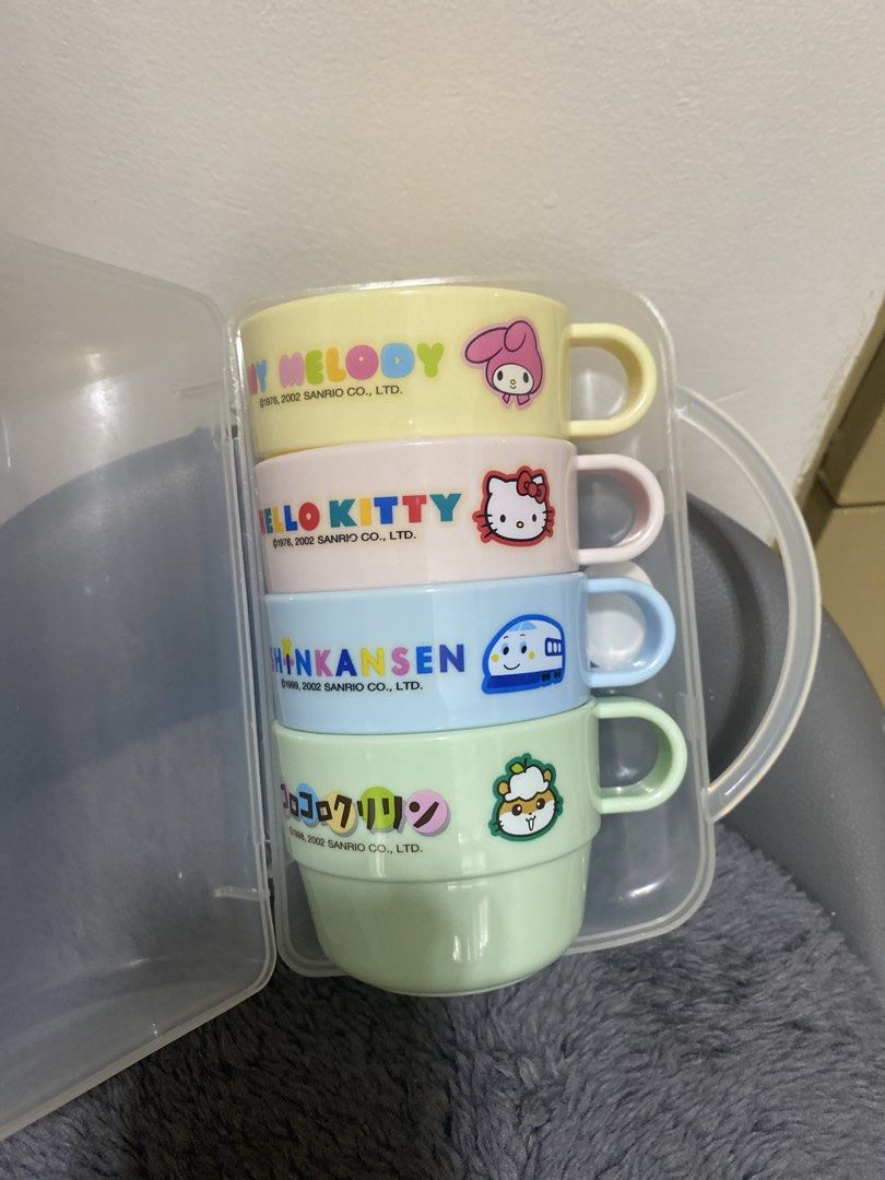 Vintage! Sanrio Stackable Cups Set (Category: Coffee & Tea Tableware) located in Marikina City. Submitted by myprelovedcollectibles (Listing ID 1433245800, Image 1). Description: - Sanrio character cup set - Includes four stackable cups - Features Kitty, My Melody, and two other characters - Comes with a clear plastic container - Pastel colors - Made of plastic - One cup marked "KS-G1" and "Made in Japan".