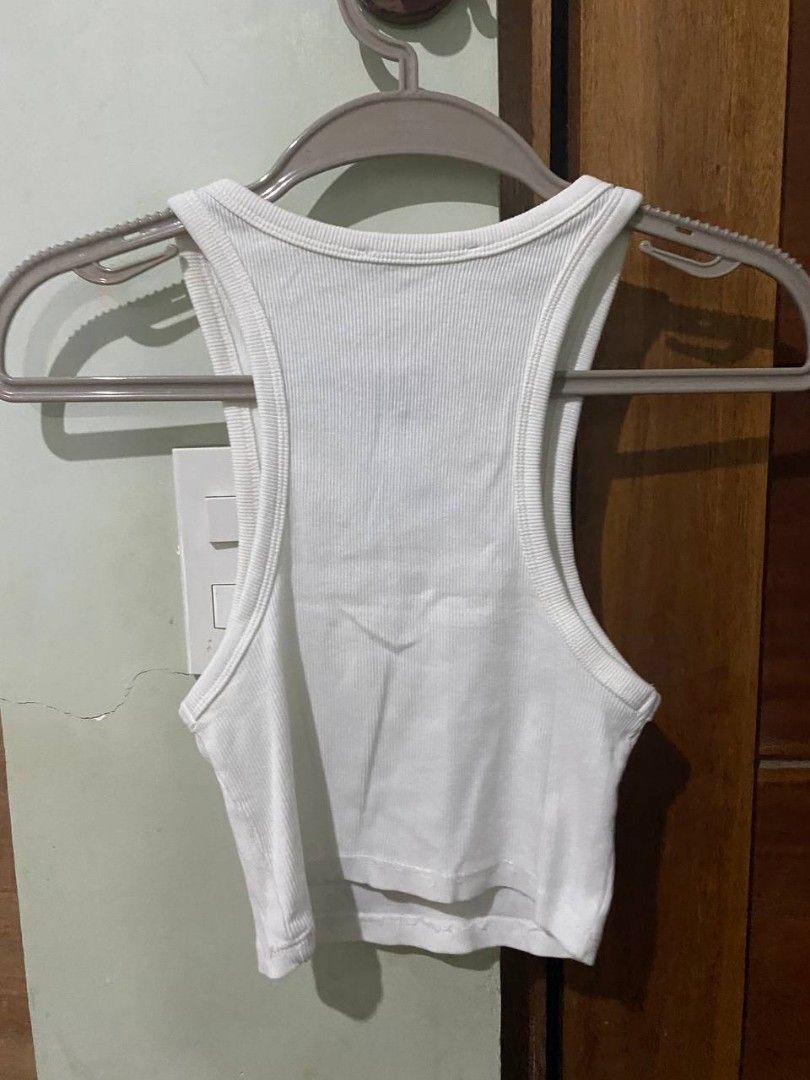 white ribbed tank top (Category: Sleeveless) located in Pasay City. Submitted by dannah__ (Listing ID 1433356893, Image 2). Description: .