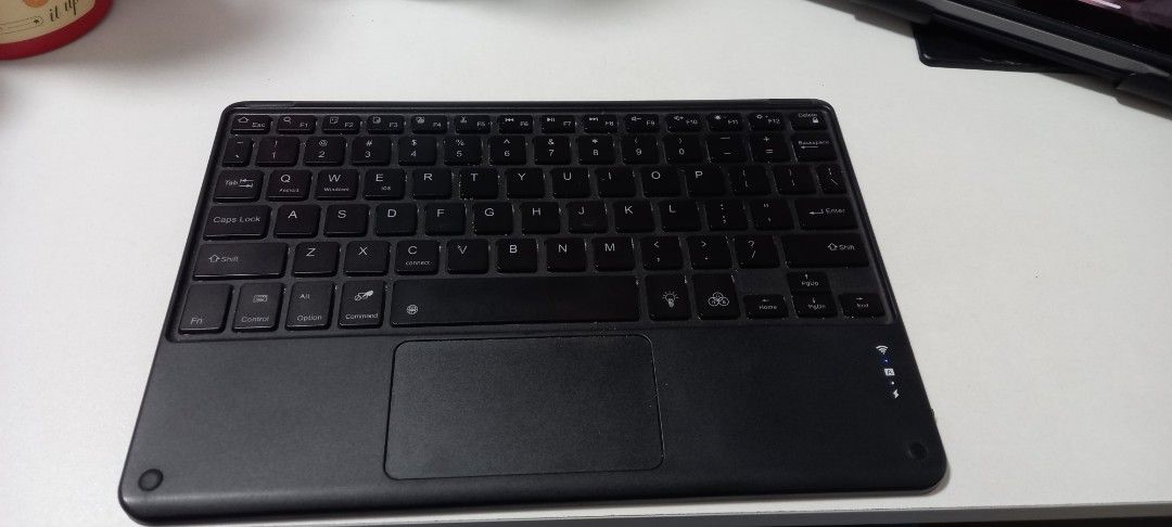 Wireless Keyboard with Touchpad (Category: Computer Keyboard) located in Quezon City. Submitted by rowie08 (Listing ID 1433236133, Image 3). Description: - Wireless keyboard with integrated touchpad - Used with ipad 5th gen - Bought a few years ago for 1k - Been a while since I used it but it still turns on and should be working - RFS: Decluttering Shipping shouldered by buyer.