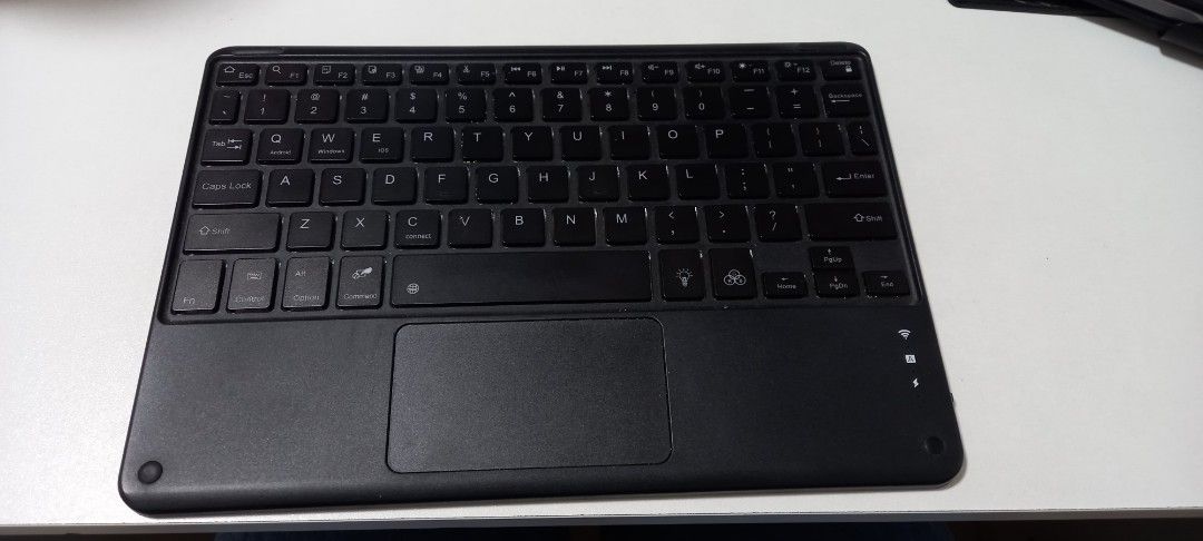 Wireless Keyboard with Touchpad (Category: Computer Keyboard) located in Quezon City. Submitted by rowie08 (Listing ID 1433236133, Image 1). Description: - Wireless keyboard with integrated touchpad - Used with ipad 5th gen - Bought a few years ago for 1k - Been a while since I used it but it still turns on and should be working - RFS: Decluttering Shipping shouldered by buyer.