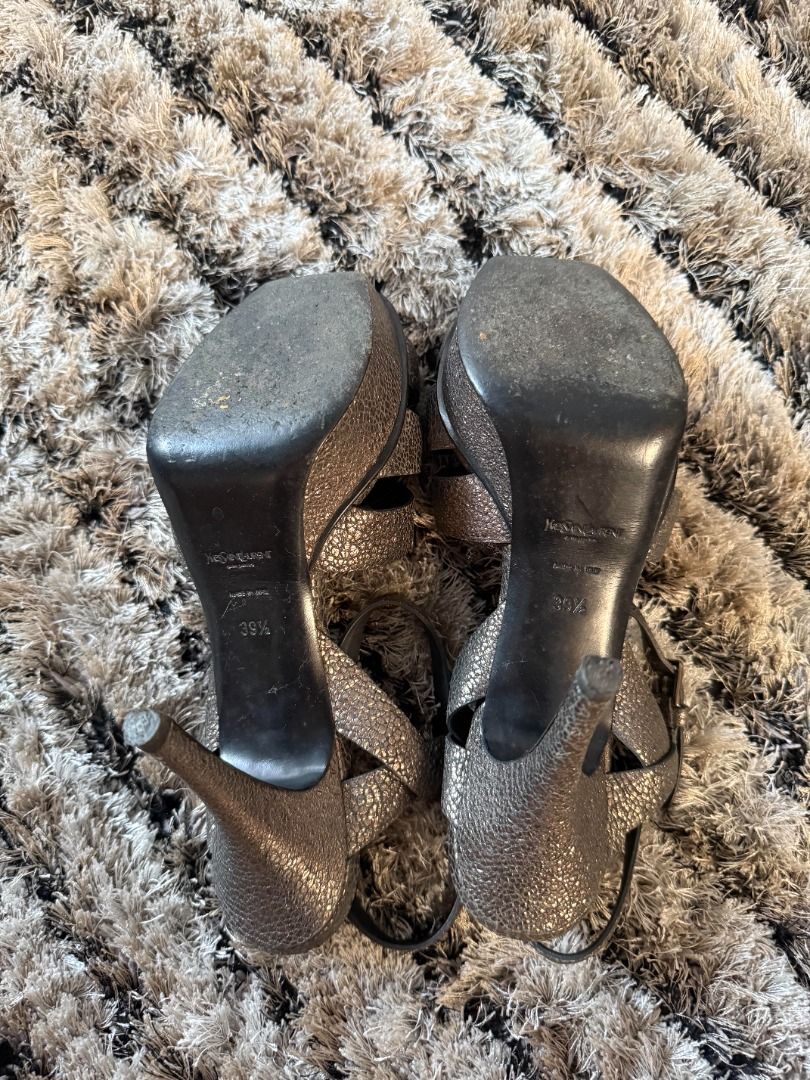 YSL Saint Laurent Tribute Heels (Category: Sneakers & Footwear) located in Muntinlupa City. Submitted by clauisstuff (Listing ID 1433231343, Image 3). Description: 100% AUTHENTIC Current Retail Price: PHP 75,000 Iconic Saint Laurent (YSL) Tribute Platform Sandals - Pebbled leather with metallic finish - Size 36.5 - Moderate heel height - Strappy design with buckle closure No issues except worn out soles RFS: Decluttering MOP: BDO/BPI/GotTyme only