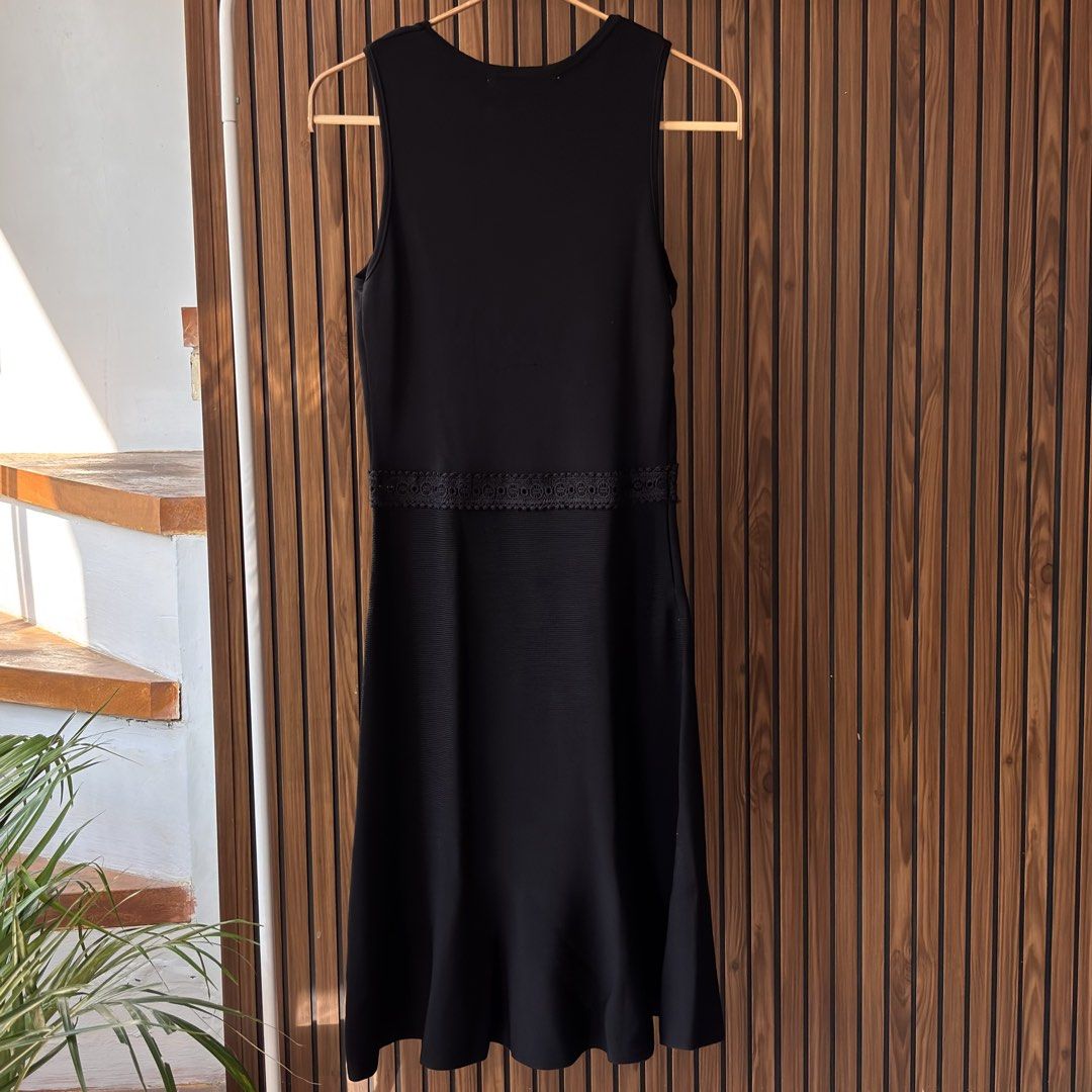 ZARA Black Knit Dress (Category: Dresses) located in Cavite. Submitted by declutteringmama12 (Listing ID 1433318784, Image 2). Description: ZARA Black Knit Dress - Size S Minimalist but striking — a timeless black dress with subtle details that elevate the whole look 🖤✨ • Structured knit fabric (holds shape beautifully) • Flattering sleeveless cut • Defined waist with subtle detail • Slight flare skirt for that feminine silhouette 🛍️ RFS: Close