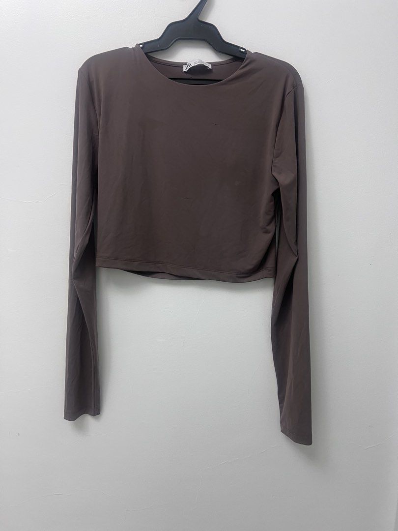 Zara Brown Taupe Polyamide Crop Top (Category: Others Tops) located in Manila. Submitted by lunaluvgood (Listing ID 1433313550, Image 1). Description: - Zara brown taupe crop top - Long sleeves - Round neckline - Solid color - Smooth fabric - Has a run (not really obvious but see last pic) - Some light stain (just needs to be washed) - Selling low na.