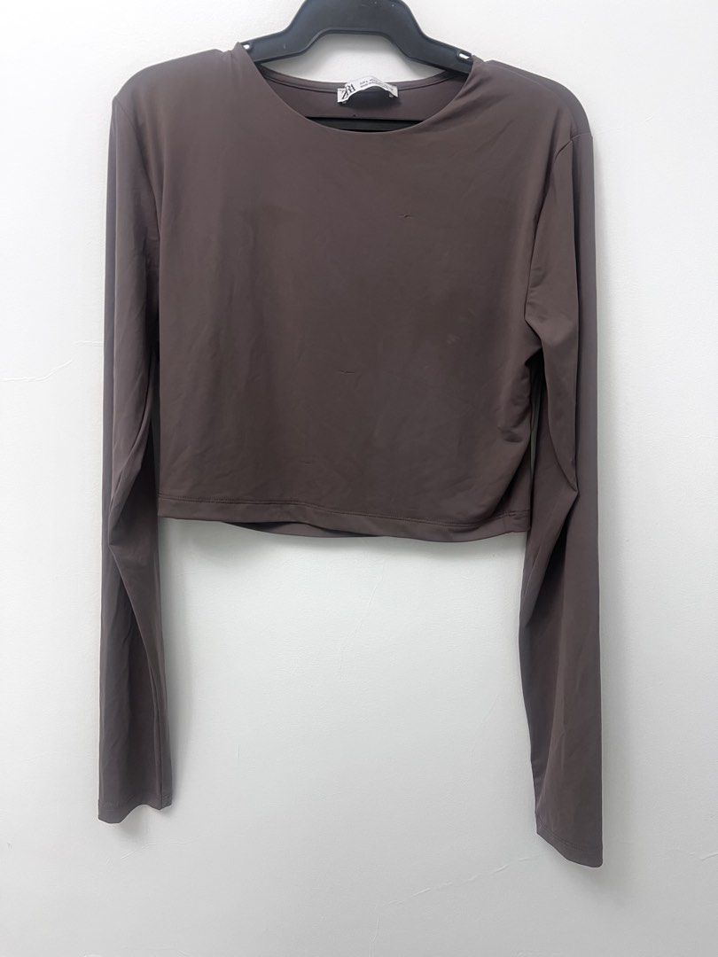 Zara Brown Taupe Polyamide Crop Top (Category: Others Tops) located in Manila. Submitted by lunaluvgood (Listing ID 1433313550, Image 2). Description: - Zara brown taupe crop top - Long sleeves - Round neckline - Solid color - Smooth fabric - Has a run (not really obvious but see last pic) - Some light stain (just needs to be washed) - Selling low na.