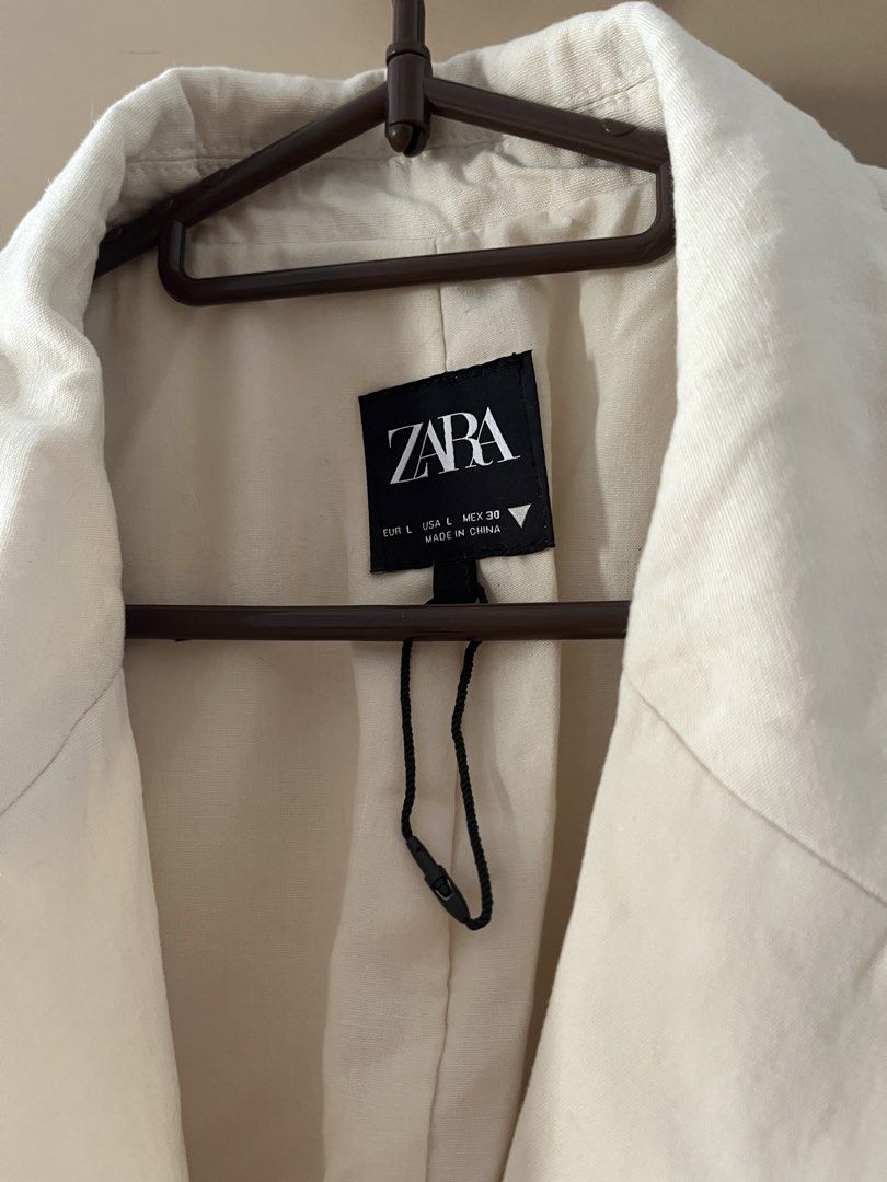 Zara Cropped Linen Short-sleeve Blazer (Category: Coats, Jackets and Outerwear) located in Manila. Submitted by yuzudeclutter (Listing ID 1433295368, Image 3). Description: - Zara cropped blazer - Size: L but can be worn by size M oversized - Color: Neutral - Features a tie closure in front - Short sleeves - Versatile style Original Price: Php2,500 Worn once RFS: Decluttering .