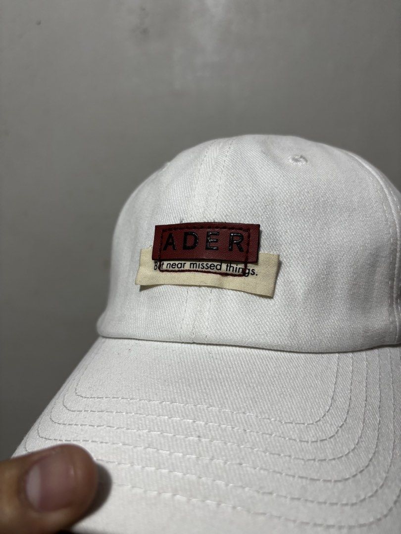 Ader Error Baseball Cap (Category: Caps & Hats) located in Calamba. Submitted by sinauna. (Listing ID 1433558470, Image 2). Description: WTS: Ader Error Baseball Cap - White Condition/Issues: needs cleaning Price: Mine - 599+SF Plus shipping fee! Free shipping if you purchase more than 3 items. Also, I can give you a discount in my previous listings so check it out! Thank you! Keep safe! 🫂 It might not be available to other shops, cop it while y