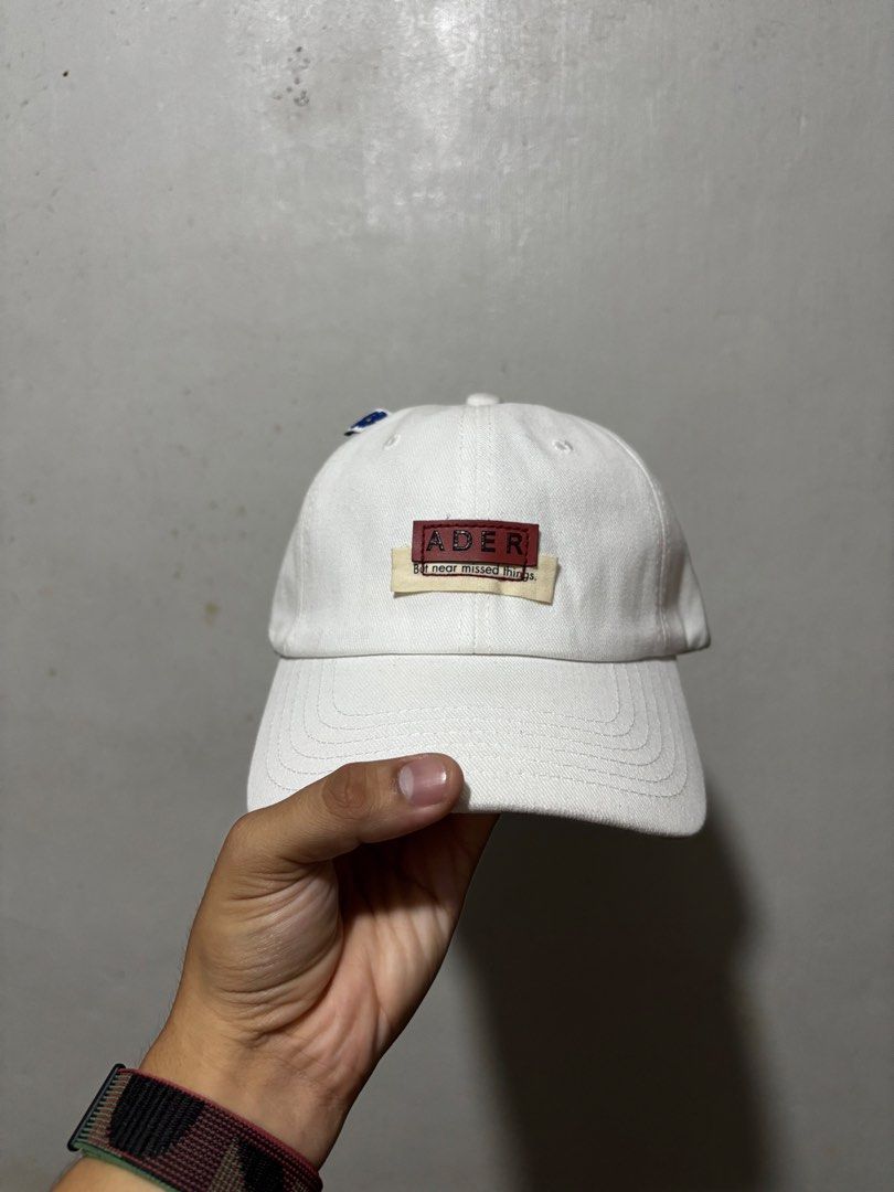 Ader Error Baseball Cap (Category: Caps & Hats) located in Calamba. Submitted by sinauna. (Listing ID 1433558470, Image 1). Description: WTS: Ader Error Baseball Cap - White Condition/Issues: needs cleaning Price: Mine - 599+SF Plus shipping fee! Free shipping if you purchase more than 3 items. Also, I can give you a discount in my previous listings so check it out! Thank you! Keep safe! 🫂 It might not be available to other shops, cop it while y