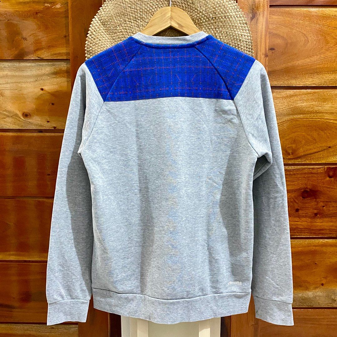 Adidas Climalite Crewneck Sweatshirt - Small (Category: Coats, Jackets and Outerwear) located in Baguio. Submitted by essgee28 (Listing ID 1433528760, Image 2). Description: Dimes: 19"x26.5" - Adidas Climalite sweatshirt - Color: Grey with blue accents - Size: Small - Features Adidas logo and pocket detail - Made in China - Material: 60% cotton, 40% polyester - Care instructions available on tag Gentle reminder: ▪️Manage your expectations since t
