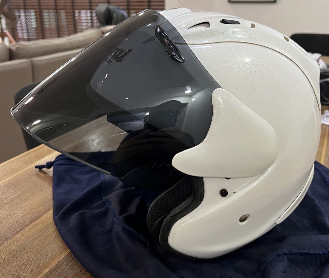 Arai Helmet (Ram4) Pearl White (Category: Motorcycle Accessories) located in Singapore. Submitted by nenekoisaplollipop (Listing ID 1433401781, Image 2). Description: - Arai Ram4 - Pearl White - XL - Mint Condition - Smoke Visor - arai String Bag - minor scratch.