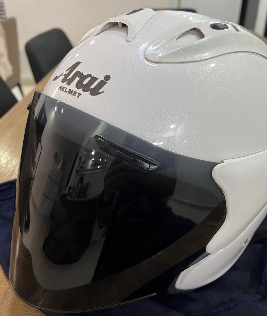 Arai Helmet (Ram4) Pearl White (Category: Motorcycle Accessories) located in Singapore. Submitted by nenekoisaplollipop (Listing ID 1433401781, Image 1). Description: - Arai Ram4 - Pearl White - XL - Mint Condition - Smoke Visor - arai String Bag - minor scratch.