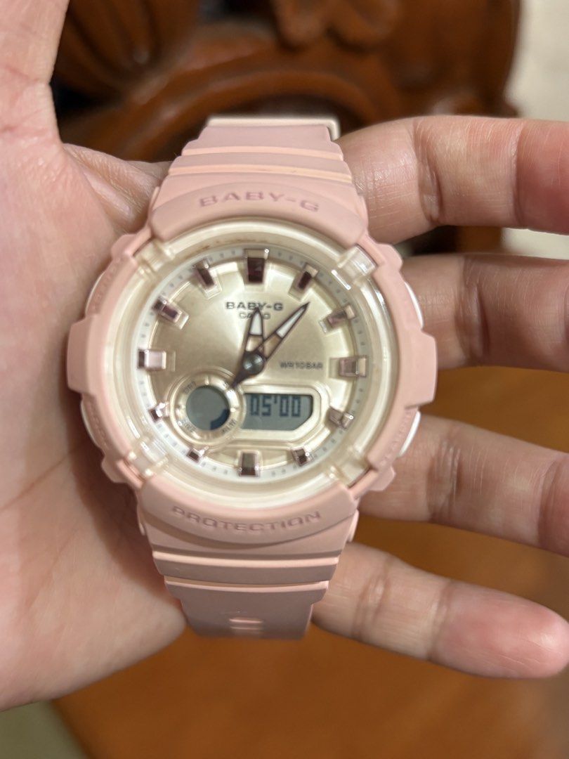 Baby-G Pink Digital Watch (Category: Women's Watches) located in Quezon City. Submitted by oondin (Listing ID 1433430424, Image 2). Description: - Baby-G watch with a stylish pink resin strap and case. - Features a digital display and analog hands for easy time reading. - Water-resistant up to 100 meters, perfect for everyday wear and water activities. - Multiple buttons for adjusting time and other functions. - bought in Japan Rfs: prefer my Gar