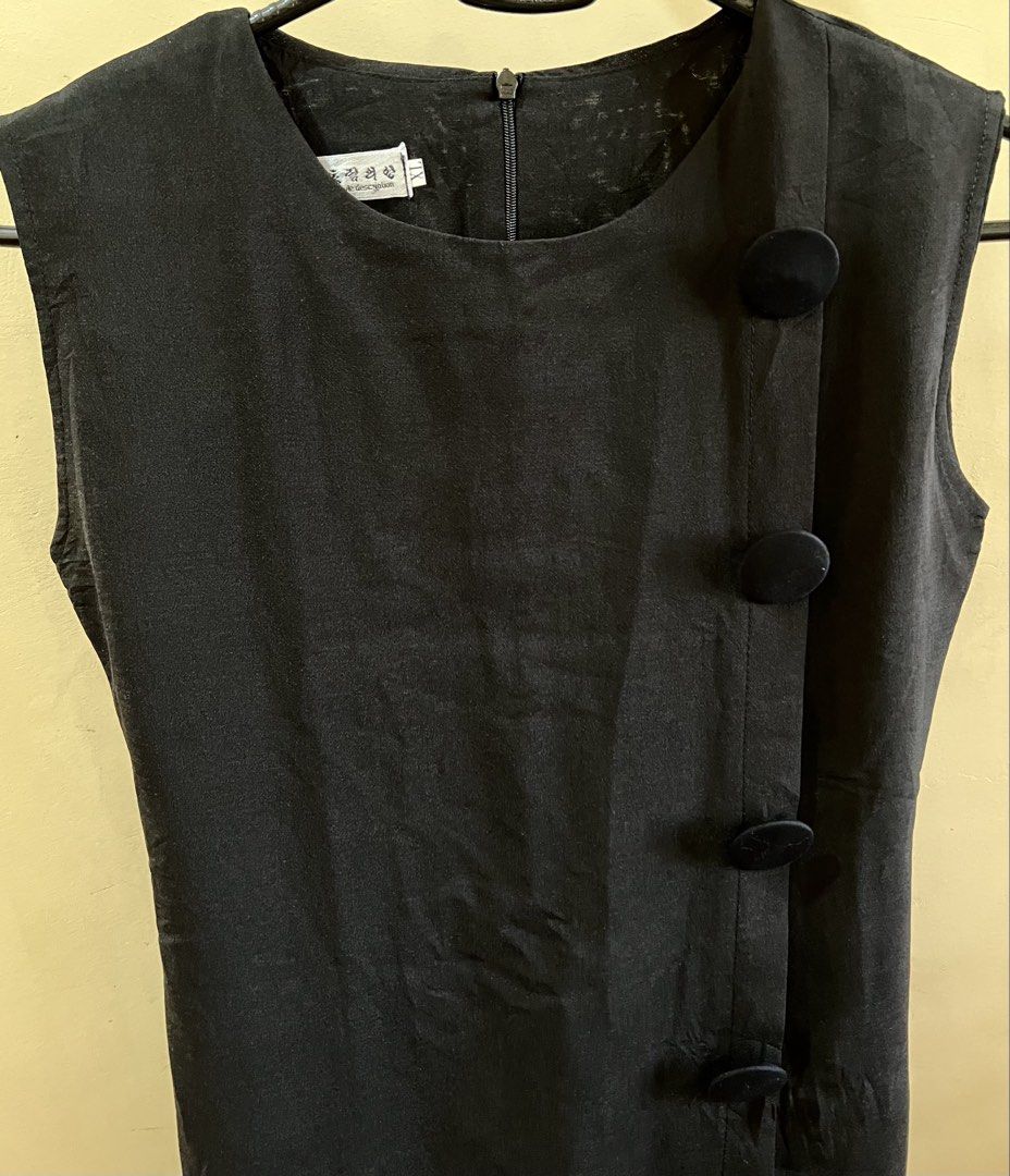 Black Sleeveless Dress with Buttons (Category: Dresses) located in Quezon City. Submitted by byandi (Listing ID 1433448025, Image 2). Description: - Black sleeveless dress - Round neckline - Decorative buttons - Fitted silhouette - Knee-length - Subtle sheen fabric - Classic design - Suitable for various occasions.