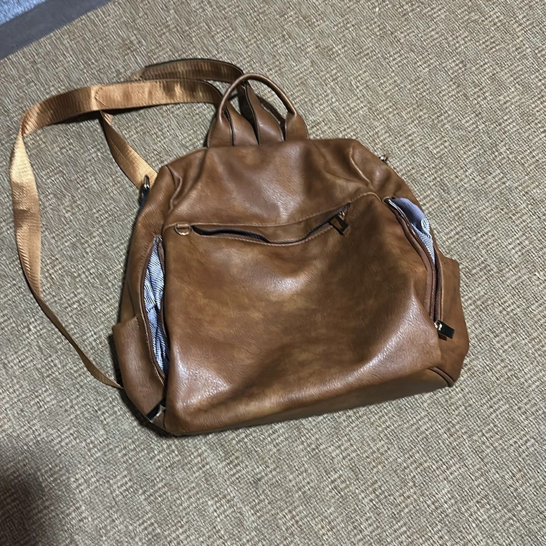 Brown Faux Leather Backpack (Category: Backpacks) located in Manila. Submitted by hhhopspp (Listing ID 1433553402, Image 2). Description: Faux Leather Backpack Excellent Condition Has multiple pockets inside and out Very sturdy and stylish.