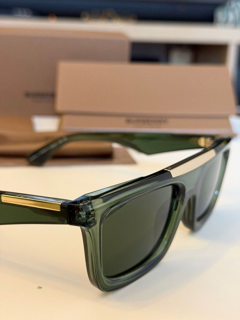 Burberry BE4451U Eye Wear (Category: Sunglasses & Eyewear) located in Quezon City. Submitted by _cmluxephilippines (Listing ID 1433531174, Image 2). Description: Burberry BE4451U model in a transparent green colorway. These rectangular-frame sunglasses are part of Burberry's modern eyewear collection and are known for several distinctive design features: Pretavoir Pretavoir +1 Design Details: They feature a polished gold metal brow bar that runs 