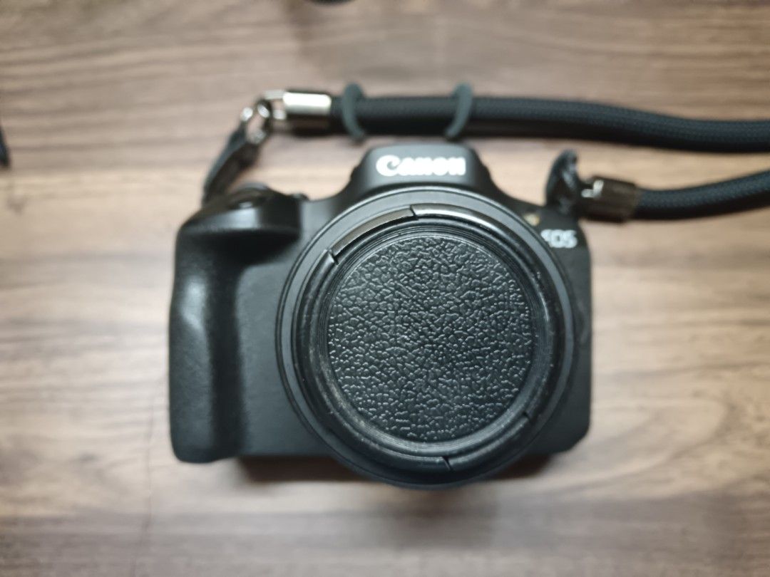 Canon EOS R100 + Kitlens, Cage & Battery (Category: Cameras) located in Bacolod City. Submitted by eosfer (Listing ID 1433522026, Image 3). Description: price negotiable Includes: - Body - 18-45mm f4.5-6.3 kitlens - 3rd party charger with 2 batteries total - Cage - No orig box - No orig lens cap - No bag // No SD card// no other issues aside from both the body and lens having cosmetic scratches -lens front plastic also ripped off, cosmetic also m