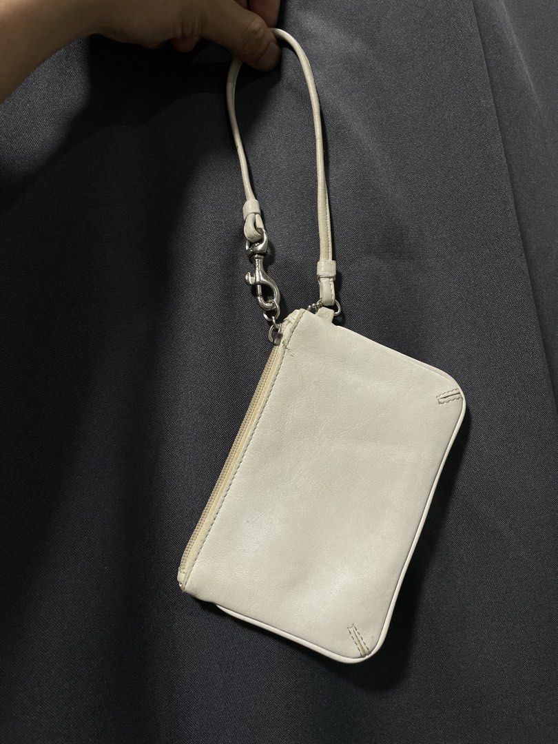 Coach White Leather Clutch Wristlet (Category: Luxury Bags & Wallets) located in Davao. Submitted by lwky_thrift (Listing ID 1433528936, Image 2). Description: Coach White Leather Clutch Wristlet Authentic Sign of usage kindly Duoble check the attached photos..