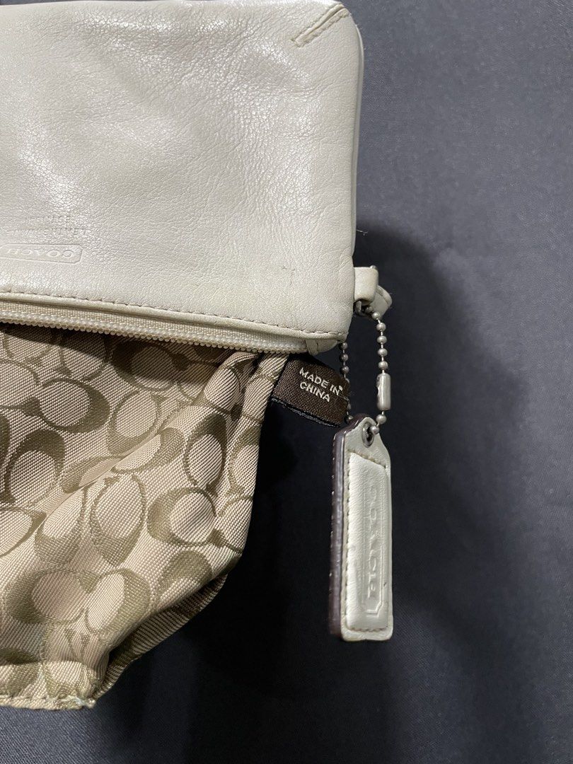 Coach White Leather Clutch Wristlet (Category: Luxury Bags & Wallets) located in Davao. Submitted by lwky_thrift (Listing ID 1433528936, Image 3). Description: Coach White Leather Clutch Wristlet Authentic Sign of usage kindly Duoble check the attached photos..