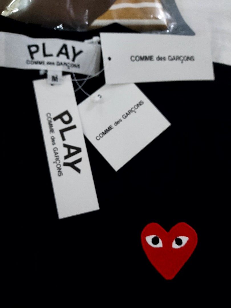 Comme des Garcons Play Black T-shirt (Category: Shirts) located in Paranaque City. Submitted by andim8 (Listing ID 1433489925, Image 2). Description: - Black Comme des Garcons Play T-shirt - Iconic red heart logo - Crew neck and short sleeves - Brand new with original tags - Comfortable fabric - Perfect for everyday wear - Classic and versatile design Brabd New with Tags.