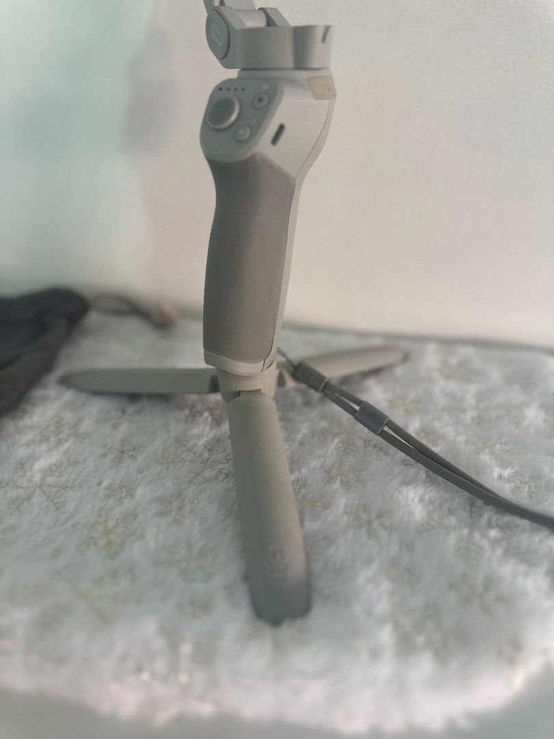 DJI Osmo Mobile 3 Combo 3-Axis Gimbal Stabilizer - Gray (Category: Gimbals & Stabilizers ) located in Naga. Submitted by nomadx (Listing ID 1433512621, Image 3). Description: DJI Osmo Mobile 3 Combo 3-Axis Gimbal Stabilizer – Good Condition Selling my DJI Osmo Mobile smartphone gimbal. Well used but still in good working condition. Stabilization works perfectly and all buttons are functional. Includes: • DJI Osmo Mobile gimbal • Mini tripod • Wri