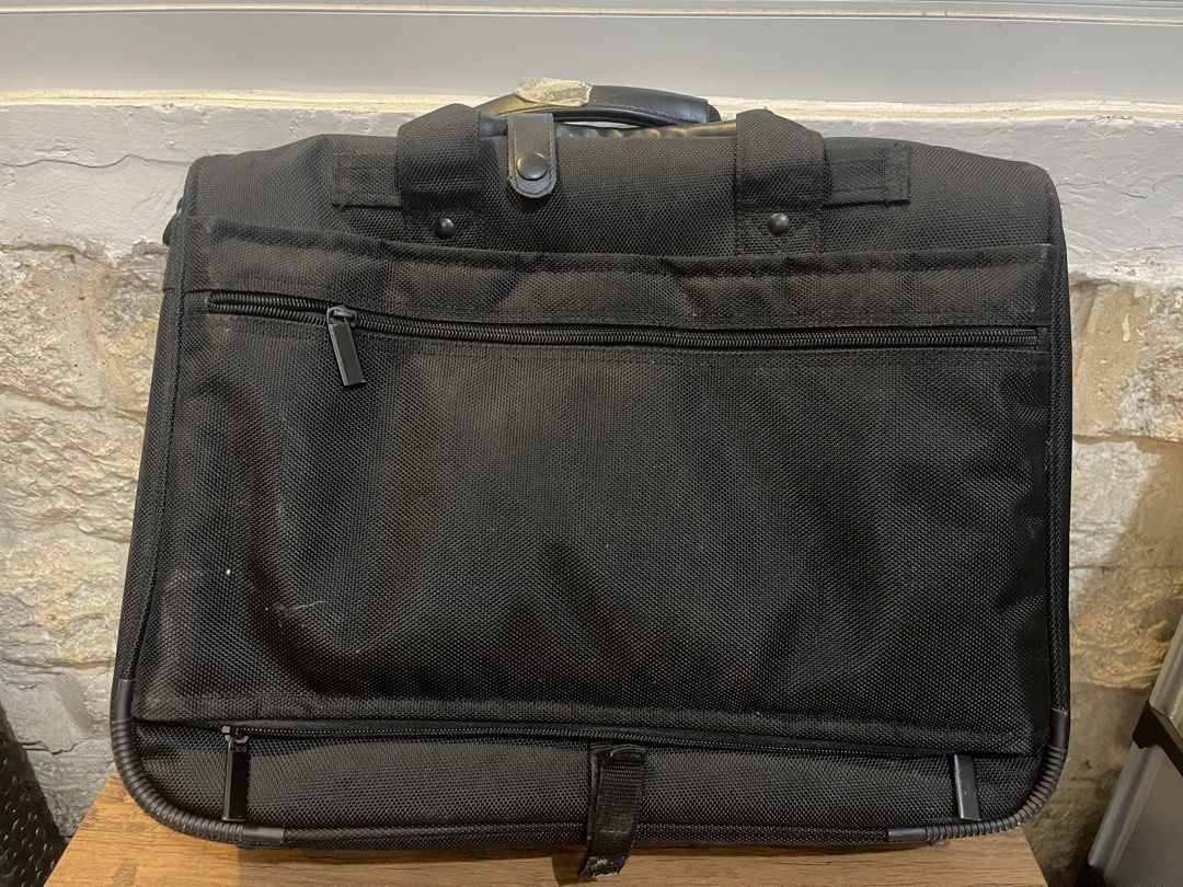Emir Laptop Bag - Black (Category: Laptop Bags & Sleeves) located in San Fernando. Submitted by japansurpluselyu (Listing ID 1433567492, Image 2). Description: 17x13 - Black laptop bag - Multiple compartments and zippers - Top handle and shoulder strap - Front pocket and internal pockets - Durable, textured fabric - Features a small Emir logo.