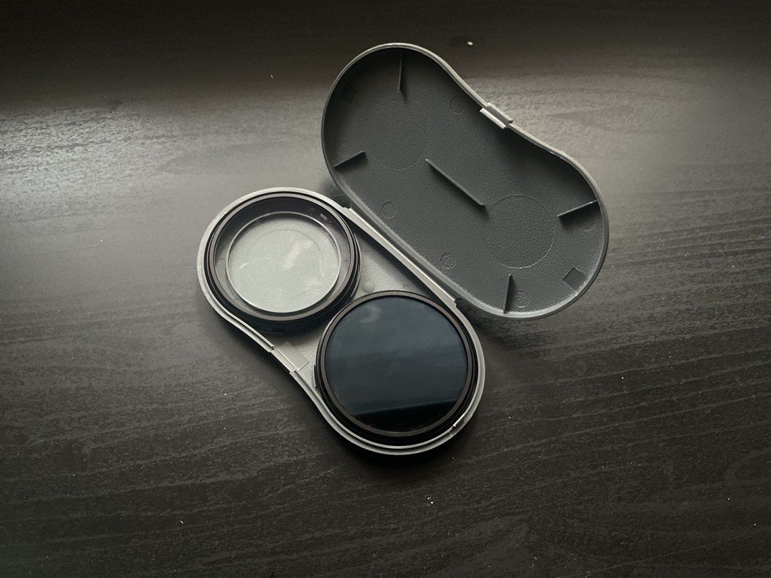 filter kit sony for lens (Category: Cameras) located in Manila. Submitted by geloreyes262956 (Listing ID 1433437116, Image 3). Description: The image shows a camera filteri kit, likely a vintage Sony PL filter kit, which includes a polarizer filter and a protector filter in a plastic carrying case. Content: Contains two circular filters (one clear, one dark/polarizing). Purpose: Filters are used to reduce glare, control reflections, or protect th