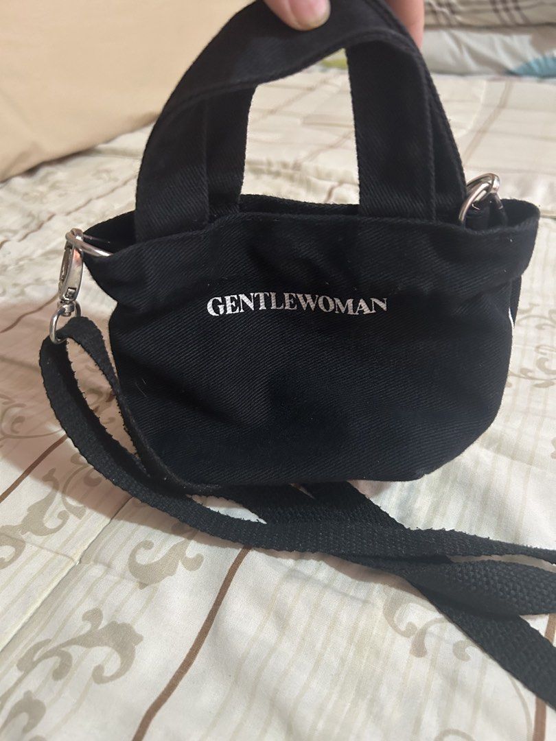 Gentlewoman Micro Tote Bag original (Category: Tote Bags) located in Taguig. Submitted by shepai (Listing ID 1433579251, Image 2). Description: - Gentlewoman Mini Tote Bag - Black canvas exterior - White Gentlewoman logo - Top handle - Detachable shoulder strap - Snap closure - Small interior pocket - Perfect for everyday essentials.