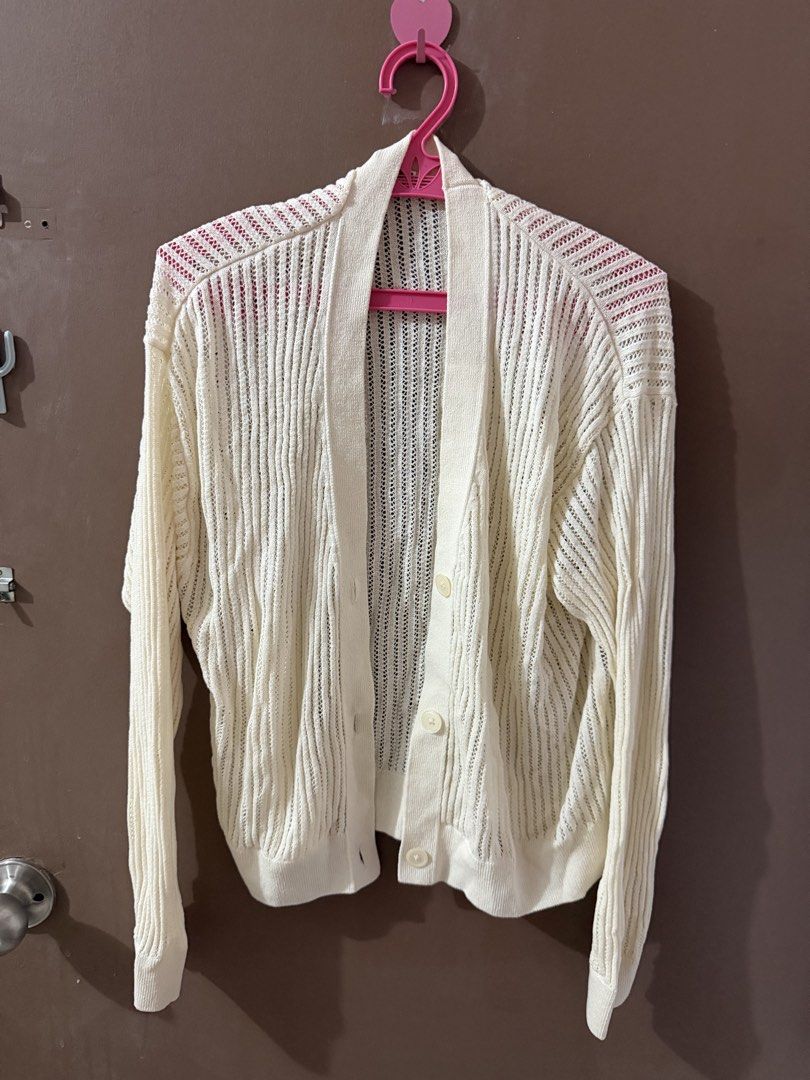 GU Cream-colored Knit Cardigan (Category: Coats, Jackets and Outerwear) located in Davao. Submitted by fabdeclutter (Listing ID 1433529756, Image 2). Description: - Cream-colored knit cardigan - Long sleeves - Button-down front - Relaxed fit - Shawl collar - Vertical ribbed knit pattern - Lightweight fabric, ideal for layering.