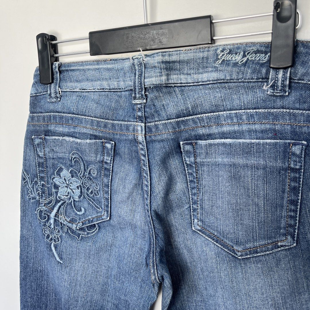 Guess Embroidered Jeans (Category: Jeans) located in Iligan City. Submitted by nick.segualan (Listing ID 1433535482, Image 1). Description: - Guess Jeans denim jeans - Embroidered floral design on back pockets - Classic five-pocket design - Button closure with Guess logo - Size: W28 L36 - Made from stretch denim - Comfortable fit - Perfect for everyday wear.