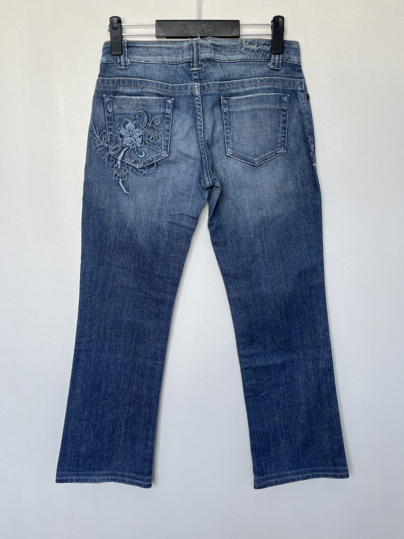 Guess Embroidered Jeans (Category: Jeans) located in Iligan City. Submitted by nick.segualan (Listing ID 1433535482, Image 2). Description: - Guess Jeans denim jeans - Embroidered floral design on back pockets - Classic five-pocket design - Button closure with Guess logo - Size: W28 L36 - Made from stretch denim - Comfortable fit - Perfect for everyday wear.