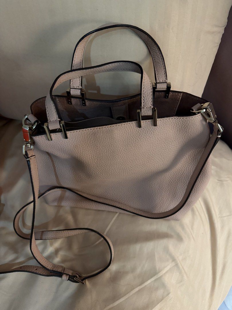 Kate Spade Light Pink Handbag with Bow (Category: Luxury Bags & Wallets) located in Pasay City. Submitted by prettystudio (Listing ID 1433533357, Image 3). Description: Flaws only on the bottom.