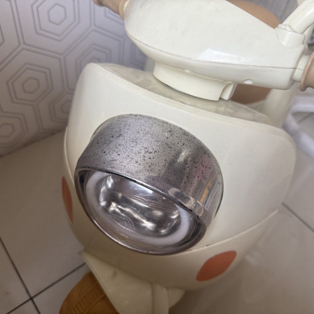 Kids Electric Scooter Rechargeable (Category: Skates, Rollerblades & Scooters) located in Marikina City. Submitted by lovegoeson (Listing ID 1433549888, Image 3). Description: - Cream-colored kids' electric scooter - Brown seat and wheels - Includes headlight and side mirrors - Features handle grips - Mickey Mouse-shaped handle at the back - In good working condition - charger missing.