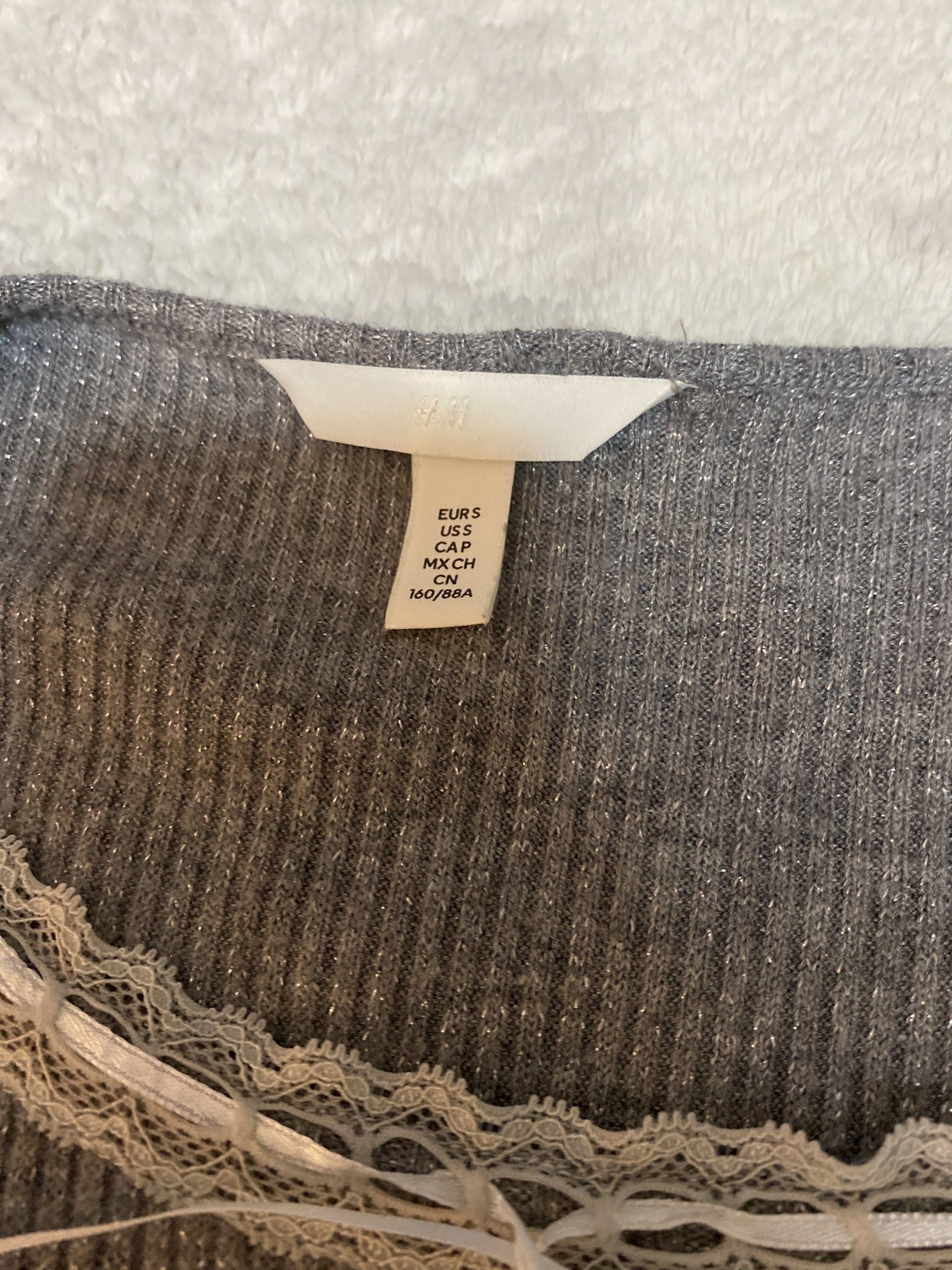 Lace y2k grey shimmer fitted top (Category: Sleeveless) located in Paranaque City. Submitted by whitegummy (Listing ID 1433493074, Image 2). Description: lalamove and j&t only somewhat cropped dm for more pics rfs: didnt like how it fit on me.