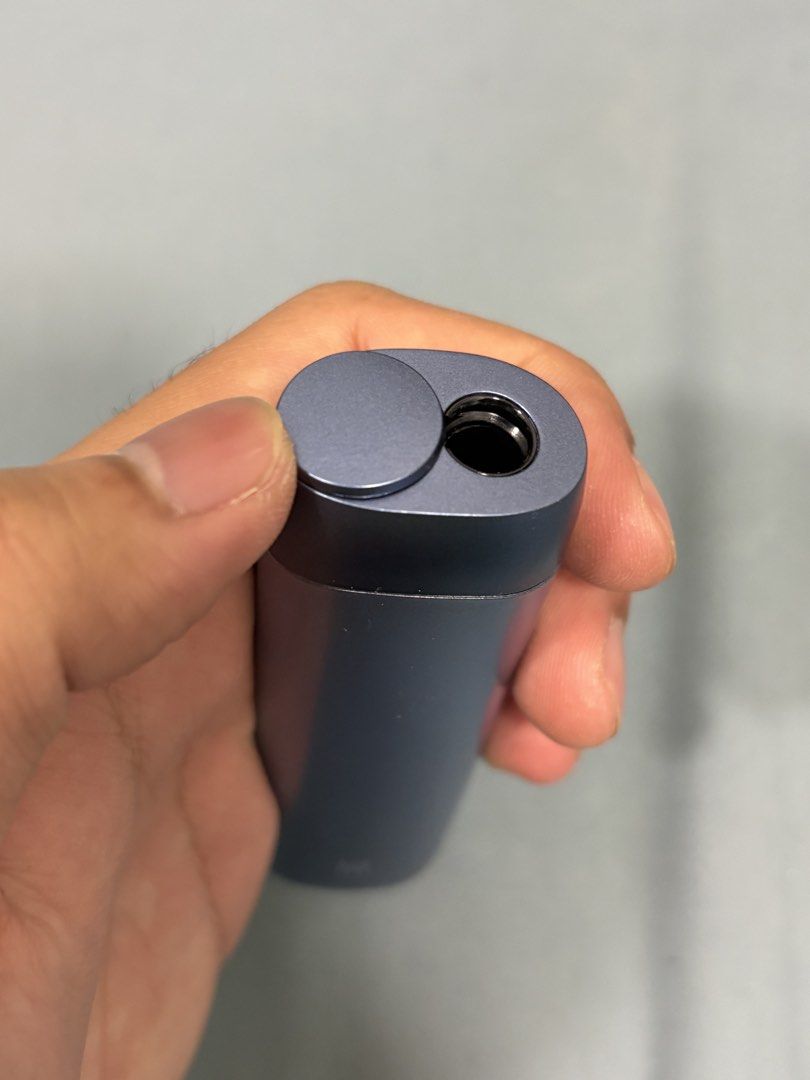 lil Solid Ez (Category: Others) located in Kuala Lumpur. Submitted by thestarcurated (Listing ID 1433526211, Image 3). Description: - lil Solid 2.0 vape device - Colour: Blue-grey - Sleek, cylindrical design - Features a button and charging port - Darker blue-grey top cap .