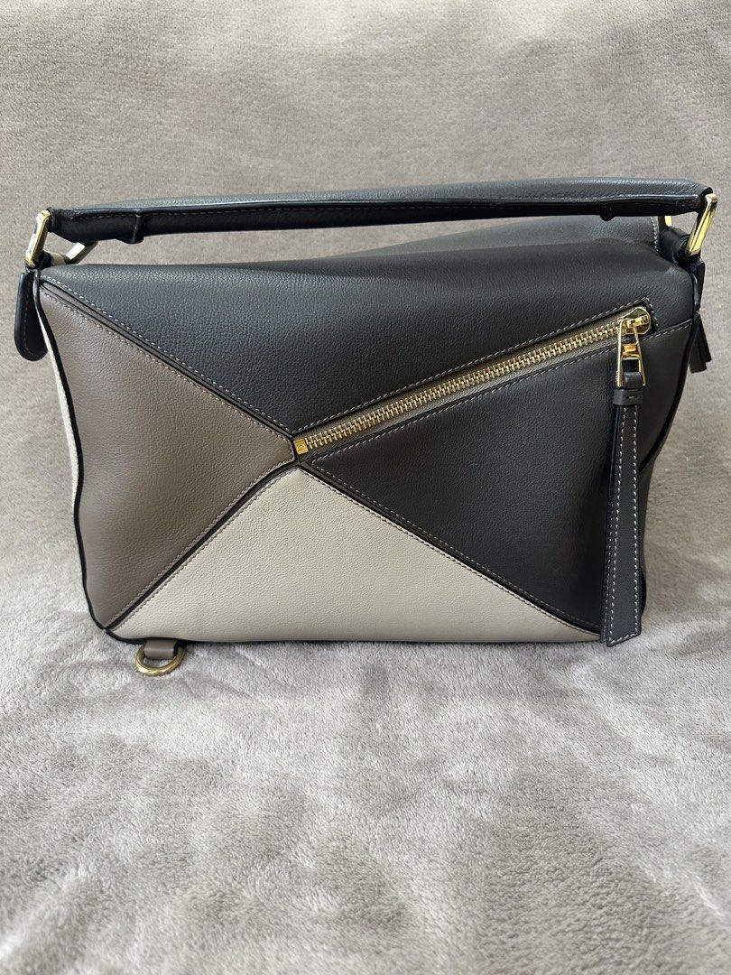 Loewe Puzzle Medium in tricolor (Category: Luxury Bags & Wallets) located in Bacolod City. Submitted by katayellow (Listing ID 1433537058, Image 2). Description: Tricolor Comes with dust bag, care cards, and strap.