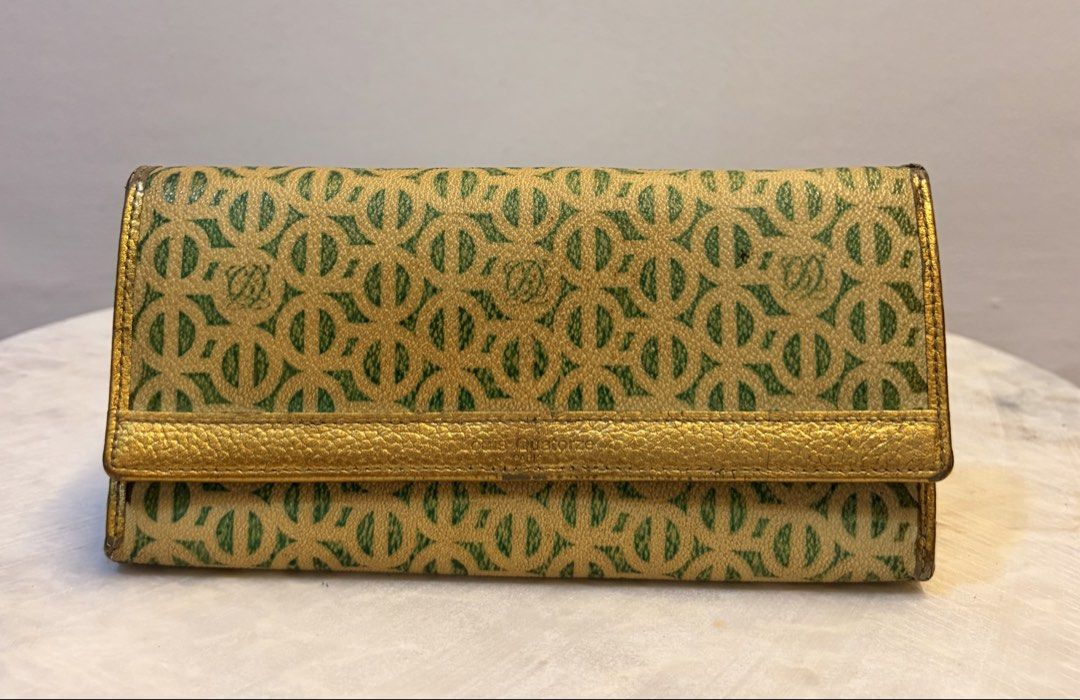 Louis Quatorze Paris Wallet (Category: Wallets & Card holders) located in Manila. Submitted by missmei07 (Listing ID 1433556752, Image 1). Description: - Louis Quatorze Paris wallet - Features a gold and green pattern - Gold interior - Multiple card slots - Zippered compartment - Snap closure - Brand name embossed on the front.