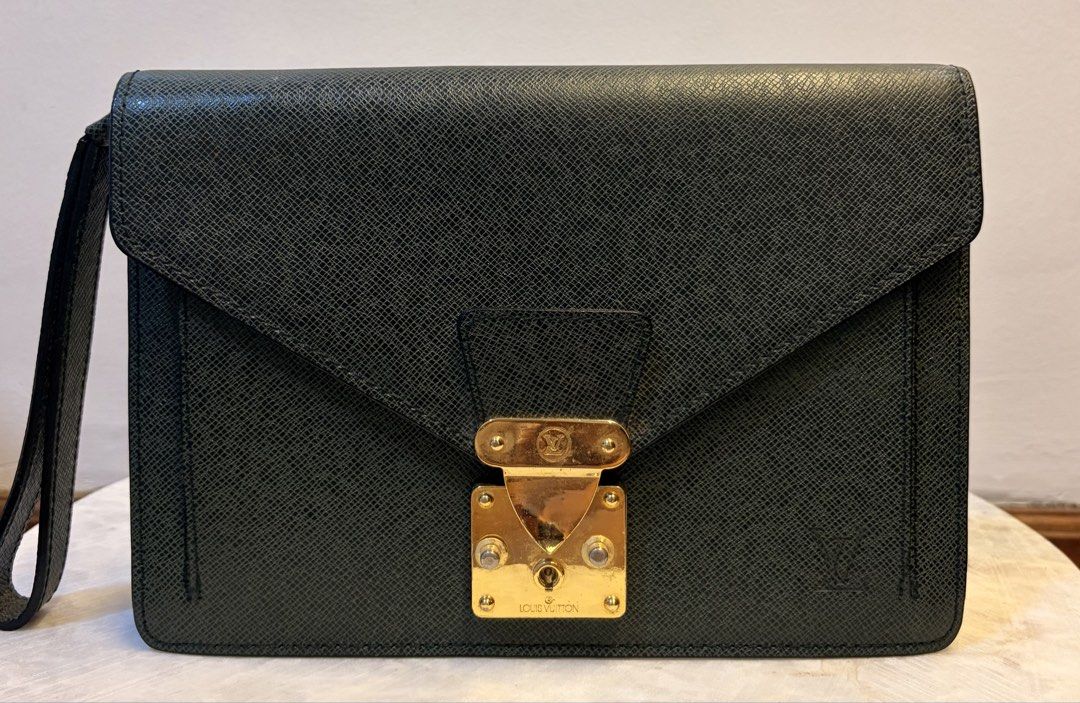 Louis Vuitton Green Clutch (Category: Luxury Bags & Wallets) located in Manila. Submitted by missmei07 (Listing ID 1433555748, Image 1). Description: - Authentic Louis Vuitton clutch - Stunning green color - Elegant gold-tone clasp and zipper - Convenient wrist strap - Signature Louis Vuitton logo inside - "Made in France" stamp - Perfect for any occasion.