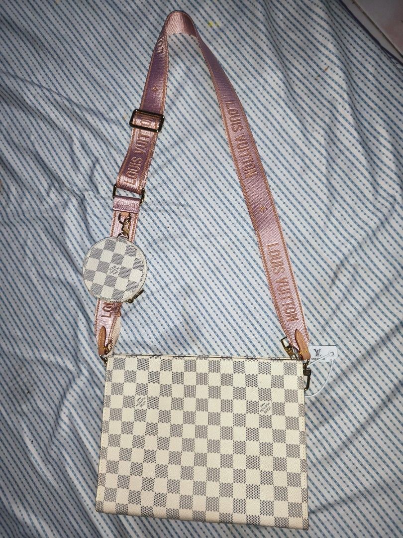 LV Multi Pochette Accessoires (Category: Luxury Bags & Wallets) located in Quezon City. Submitted by iamkarenz (Listing ID 1433536596, Image 1). Description: - Louis Vuitton Multi Pochette Accessoires -Felicie Strap and Go - Damier Azur pattern - Pink strap and interior - Includes small coin purse - Gold zipper and hardware - Interior pocket - Serial number: YS1888.