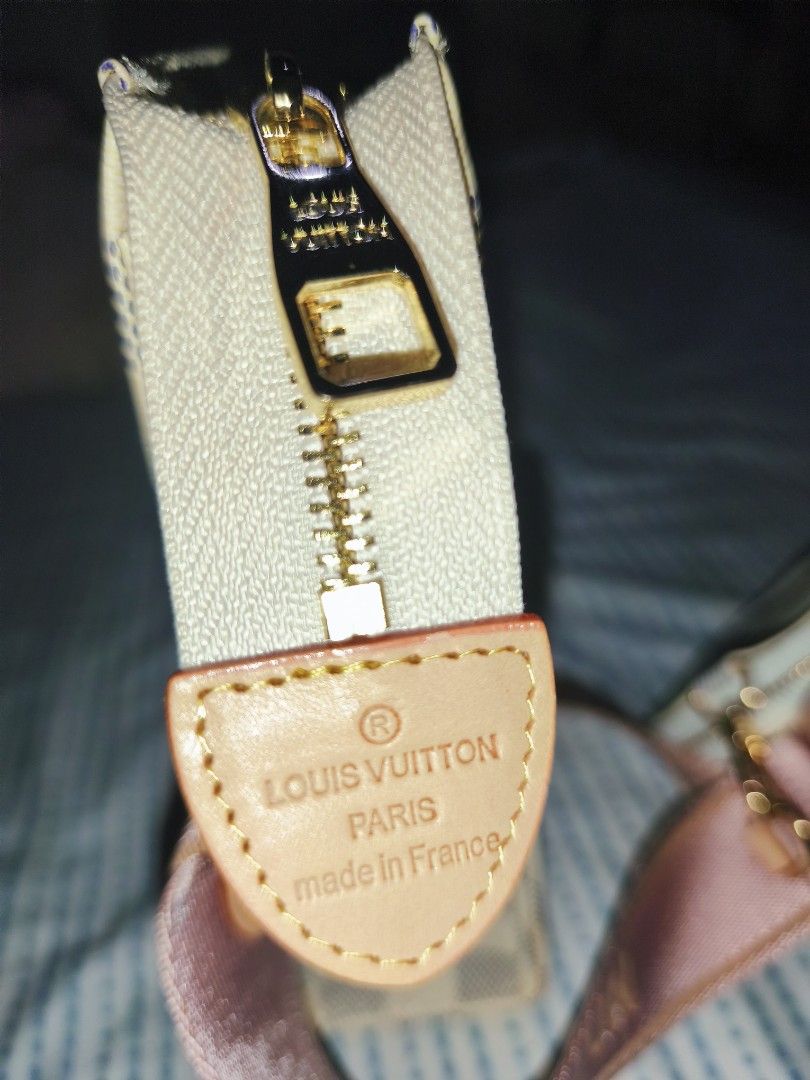 LV Multi Pochette Accessoires (Category: Luxury Bags & Wallets) located in Quezon City. Submitted by iamkarenz (Listing ID 1433536596, Image 3). Description: - Louis Vuitton Multi Pochette Accessoires -Felicie Strap and Go - Damier Azur pattern - Pink strap and interior - Includes small coin purse - Gold zipper and hardware - Interior pocket - Serial number: YS1888.